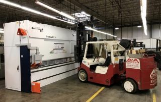 25/35 Versa-Lift placing in location a Trumpf press at a local manufacturing plant.