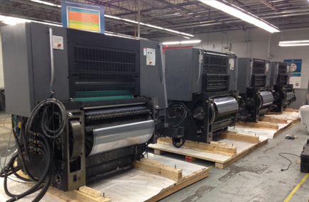 Printing press line in the staging process of being crated and packaged for international shipment. We built custom skids for each unit, secured units to the skids, double plastic wrapped, and loaded in a container.