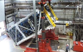 Rigging a pharmaceutical distillation column module within near-zero clearance environment using 300 ton hydraulic gantry system