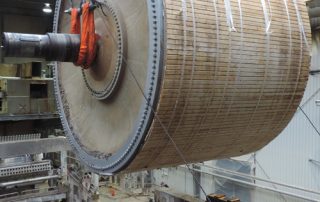 Removing 156,000 lb., 18’ diameter x 25’ long Yankee Dryer from tissue mill in Lincoln, ME for reinstallation in Canada. Dryer was wrapped in felt and then clad for protection prior to removal.