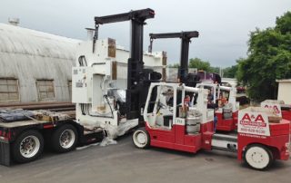 Unloading 660 ton capacity press brake frame with a pair of Versa-Lift 40/60’s.