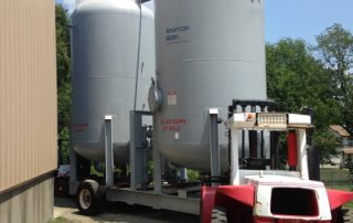 Removing the tanks from the building through a rear wall penetration with no access road.