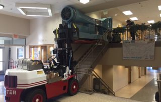 Installing lab-scale wind tunnel equipment into 2nd floor of area technical college