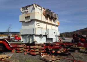 170,000 lb. transformer being loaded from ground to railcar using jacks, slider and unified hydraulic system. Scope included railcar tie-downs and later unloading from railcar to ground at destination site