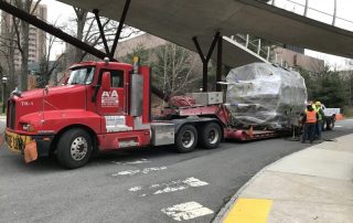 Our crew relocating an 18ft. long, 11ft. high vessel from a local University physics lab on a double-drop trailer.