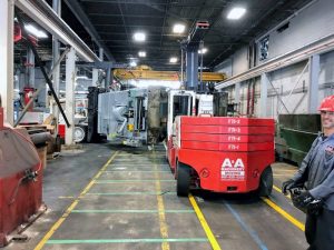 Rigging foremen are operating the Versa-Lifts remotely for better visibility maneuvering through the tight quarters of the plant, reducing the risk and damage to the press.