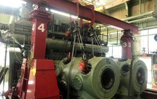 Gantry posts set up to remove and stage a few gas compressor cylinders from a 8V-250 engine frame they were attached to.